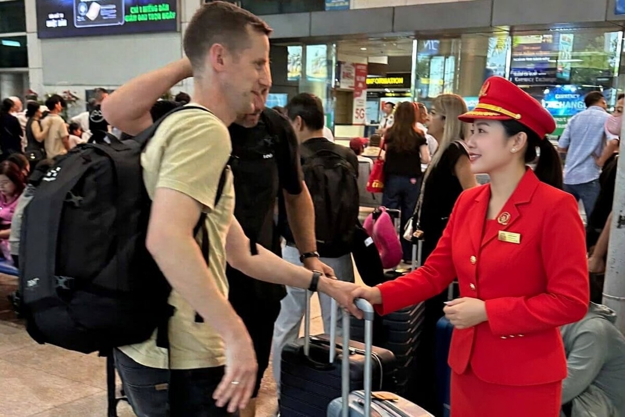 Fast track staff assisting travelers at Vietnam airport - photo 3